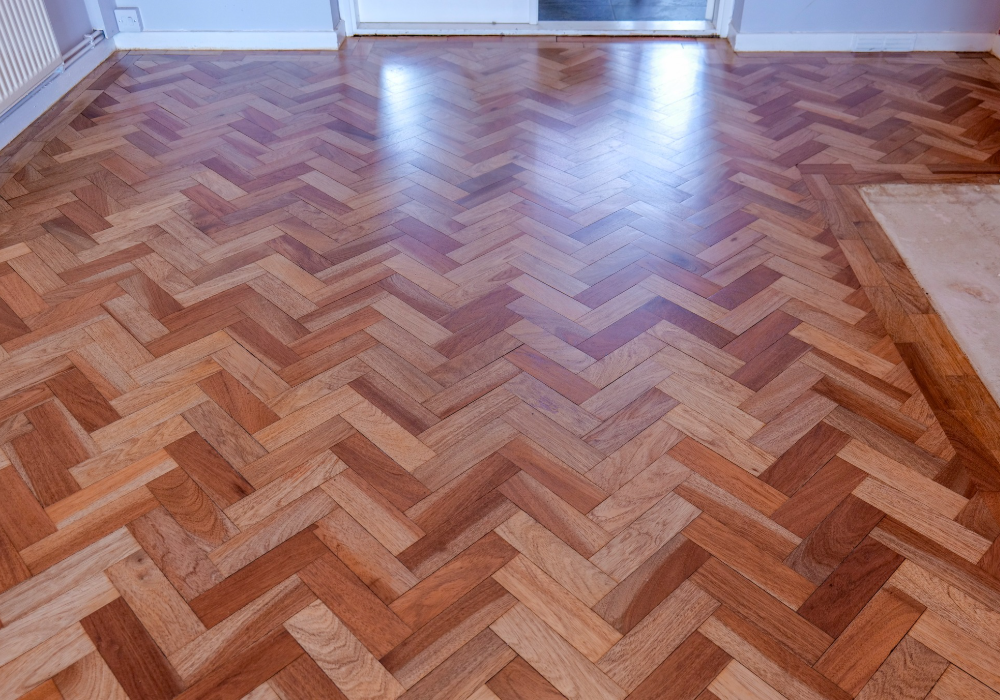 Restored parquet wood floor highlighting the natural beauty of the grain