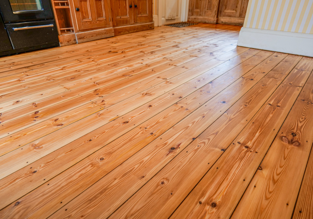 Polished and rejuvenated pine flooring, enhancing the character of the space