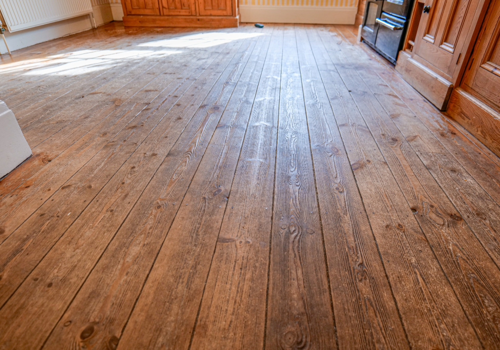 Aged floors showing signs of wear and tear before restoration